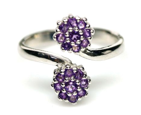 A 925 silver adjustable ring set with amethysts.