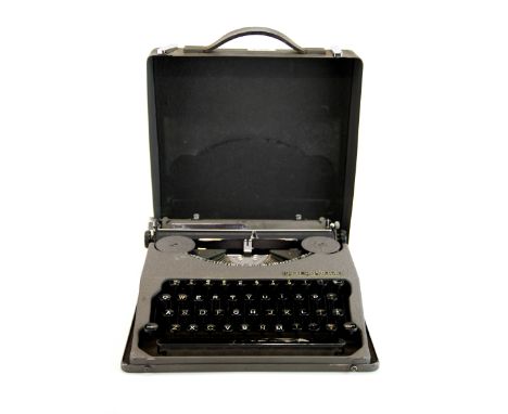 A Hermes vintage 'baby' portable typewriter.