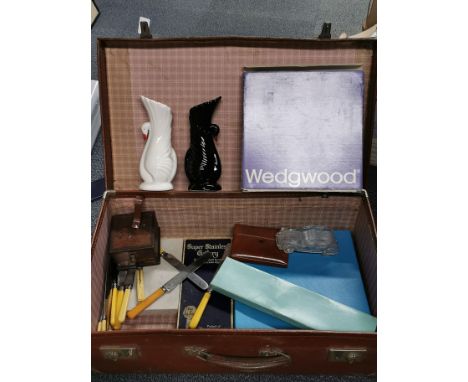 A vintage suitcase and contents.