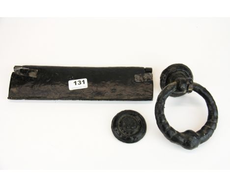 A vintage cast iron door knocker and letter box cover, cover W. 29.5. door knocker W. 13cm.