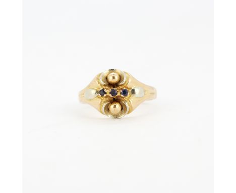 An 18ct rose and white gold ring set with round cut sapphires, (P.5). Gross weight approx. 5.9gr.&nbsp;