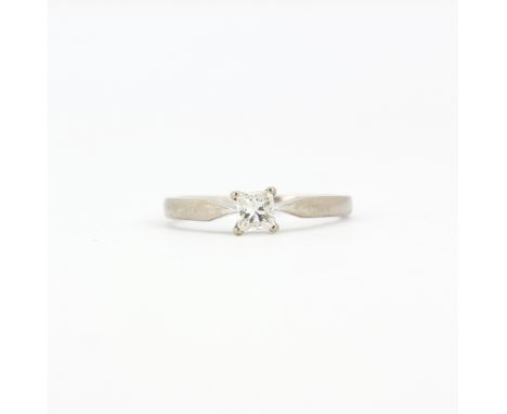 A boxed 18ct white gold solitaire ring set with a Canadian princess cut diamond, (L.5). With certificate.