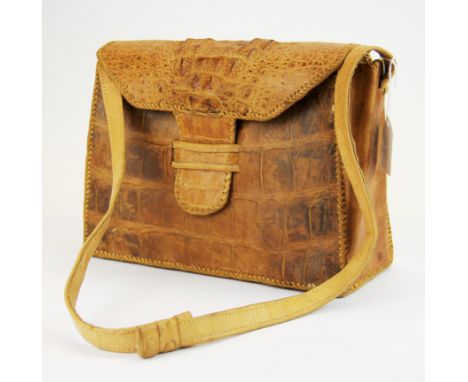 A vintage crocodile skin handbag, W. 26cm. H. 20cm.