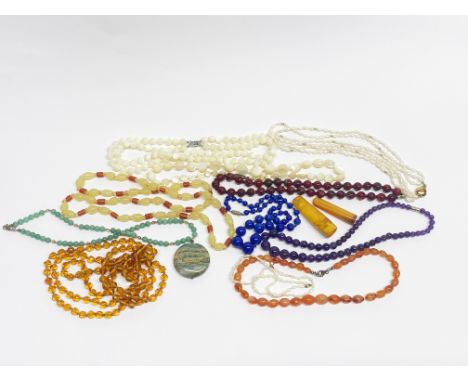 A group of amethyst, jade, mother of pearl and other necklaces etc.
