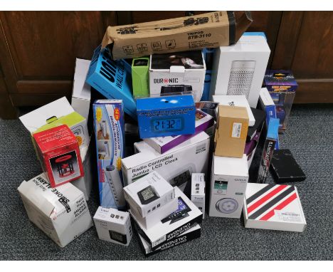 A large group of mixed household electronic items including clocks, air purifier and a spy hole camera.