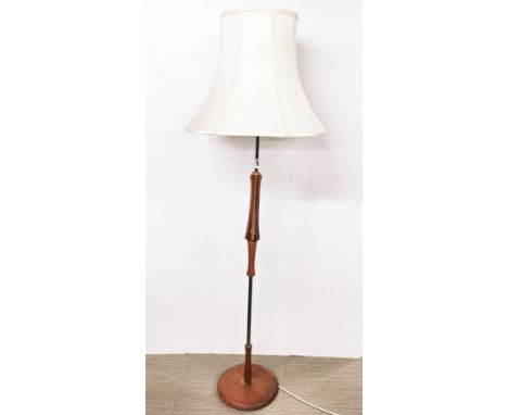 A stylish 1970's teak and brass standard lamp, H. 167cm