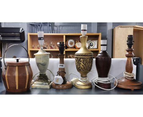 A group of vintage table lamp bases and a wooden biscuit barrel.
