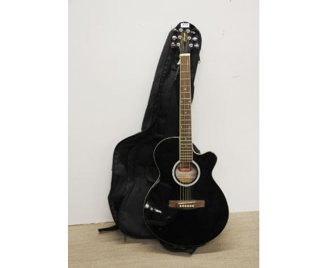 A Stagg acoustic guitar and case.