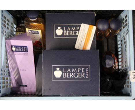 Three Berger of Paris oil lamps and quantity of lamp oil.