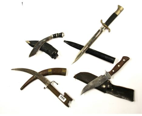 A group of four vintage daggers.
