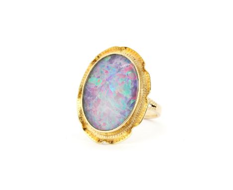 A 14ct yellow gold ring set with a large oval cut triplet opal, opal size approx. 2.2 x 1.6cm, (N.5). Gross weight approx. 6.