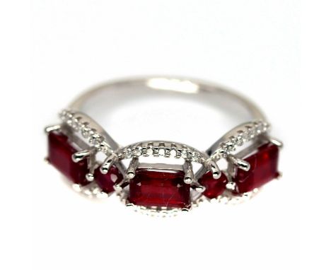 A 925 silver ring set with three baguette cut rubies and white stones, (O).