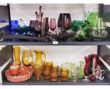 A large quantity of vintage coloured and clear glassware.