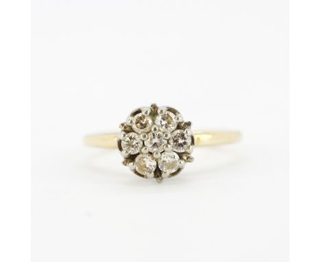 A 10ct yellow and white gold (marked 10K) diamond set cluster ring, (N).