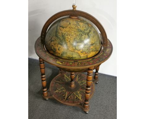 A vintage globe drinks trolley (no hinge mechanism or fitting for lid) H. 94cm.