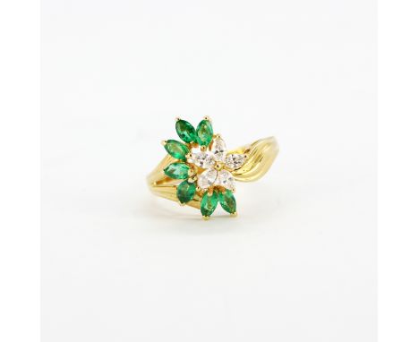 A 14ct yellow flower design ring set with marquise cut diamonds and marquise cut emeralds, (P). Gross weight approx. 3.9gr.&n