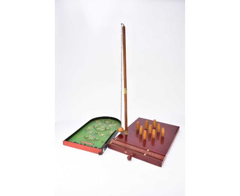 A tabletop skittles game, mid 20th century, with retractable pins and scoreboard, 50cm x 37cm, together with a 'Pin-Football'