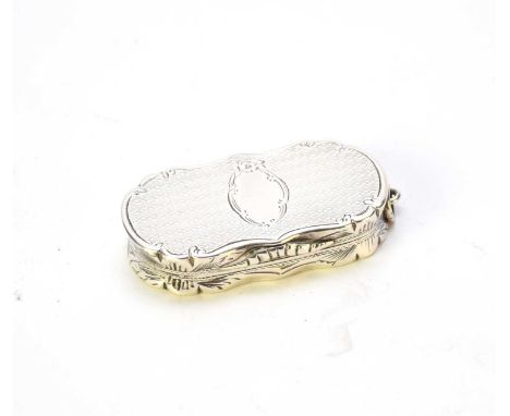 A Victorian silver vinaigrette, Colen Hewer Cheshire, Birmingham 1873, of shaped oval form with bright cut and engine turned 