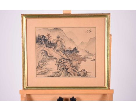 A pair of Chinese school paintings on silk, 20th century, mountain landscapes with village huts, ink and wash on, signed with