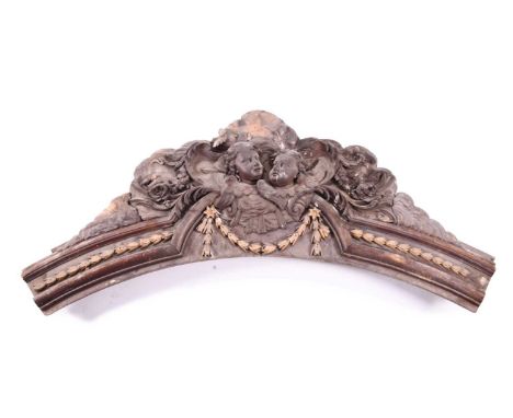 Thomas Henry Kendall: a carved stained beech architectural arch crestingComprising a central scroll cartouch containing two w
