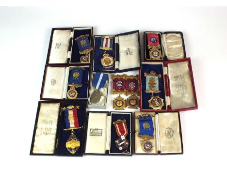 A collection of eleven masonic medallions, comprising; five silver gilt and enamel examples, five gilt and enamel examples an