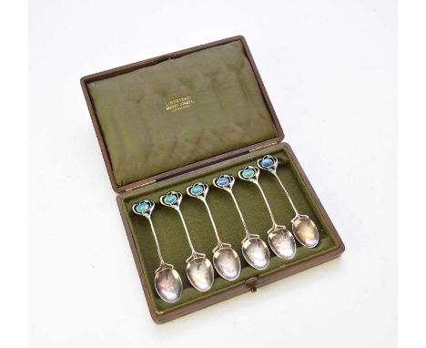 A cased set of Liberty &amp; Co Art Nouveau silver and enamel teaspoons, Birmingham 1906 &amp; 1907, each with tendril handle