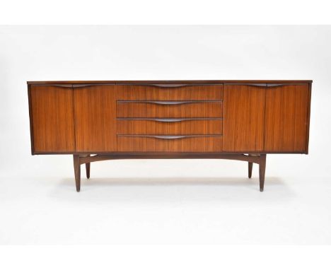 A mid 20th century teak sideboard, probably Elliots of Newbury (EoN) and retailed by Grange of London, of ty[pical low line f