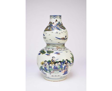 A large Chinese Wucai gourd vase, Daoguang seal mark but late 20th century, decorated with scenes of noble figures at leisure