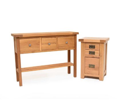 A modern light oak hall table, of joint construction, the plain top above three box drawers, raised on square supports united