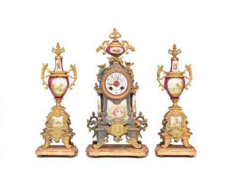 A French gilt metal and porcelain Louis XV style clock garniture, late 19th centuryThe clock with urn finial above an arched 