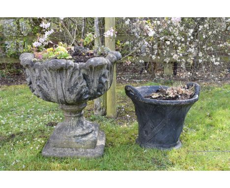 A composition twin-handled, basket-form planter, painted black, some damage, 33.5cm high, with an acanthus form urn, on a sha