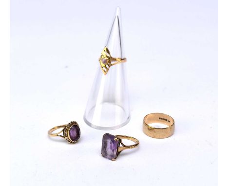 Two 9ct gold single stone amethyst rings, the oval example size K and the rectangular example size N, together with a 9ct gol