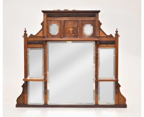 An Edwardian faux rosewood inlaid overmantel mirror, with bevelled plates and three shelves, some damage, 118cm wide x 101cm 