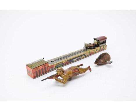 An Einfalt German clockwork tinplate soldier, 19cm long, together with an Arnold (US zone German) clockwork tinplate train tu