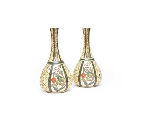 A pair of Salopian 'Rhodian' vases, decorated with flowers, incised marks on the base, 35cm highAreas of loss to the enamel p