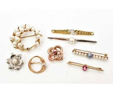 Eight gold brooches to include an 18ct yellow and white gold diamond set curb link bar brooch, four 14ct yellow and white gol