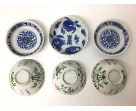 A small pair of 19th century Chinese Doucai porcelain dishes, four-character marks, 7cm diameter, together with a blue and wh