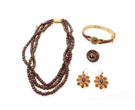 Group of antique garnet jewellery to include a 19th century Bohemian garnet hinged bangle, similar cluster ring, a pair of ea