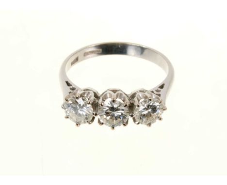 Diamond three stone ring with three brilliant cut diamonds in claw setting on 18ct white gold shank, Birmingham 1992, estimat