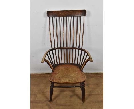 19th century ash and elm stick back Windsor arm chair, with solid saddle seat on splayed supports Good original sturdy condit