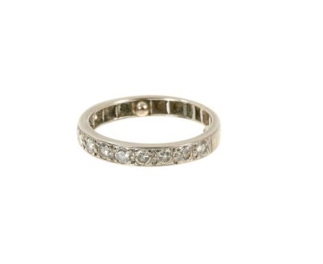 Diamond eternity ring with a half hoop of eleven brilliant cut diamonds in platinum setting. Estimated total diamond weight a