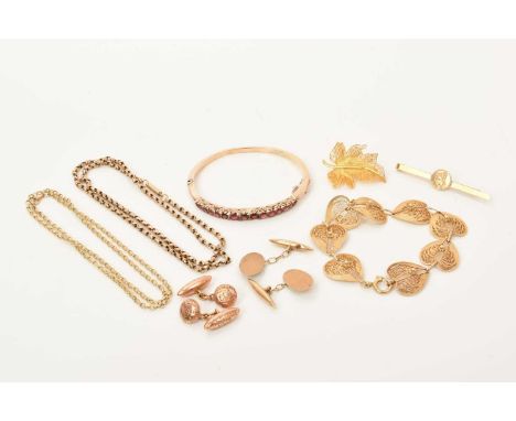 Various items of gold jewellery to include a 9ct gold garnet and red stone hinged bangle, a yellow metal filigree bracelet an