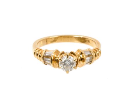 Diamond single stone ring with a round brilliant cut diamond estimated to weigh approximately 0.40cts in claw setting flanked