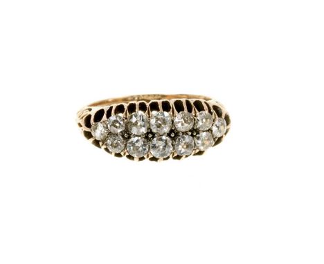 Victorian diamond two-row ring with graduated old cut diamonds in gold claw setting with carved gold shoulders, estimated tot