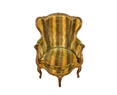 19th century French giltwood armchair, with scroll carved gilt frame on cabriole legs 104cm high, 77cm wide at arms, cushion 