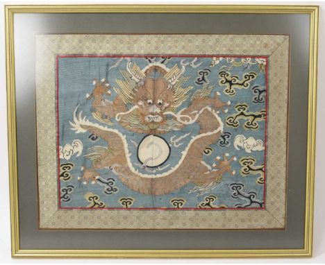 Chinese dragon embroidery, in silk border, 35 x 47cm, glazed frameNot viewed outside of frame but appears in good condition w