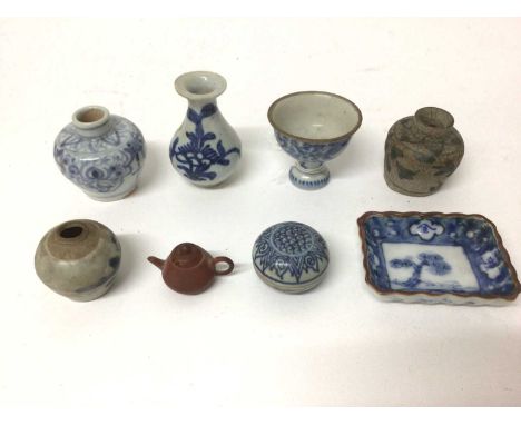 Group of miniature antique oriental ceramics, including blue and white vases and pot, a Yixing teapot, and a Japanese dish wi