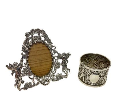 Victorian miniature silver photo frame of shaped form, with chased and pierced decoration and silver easel back (London 1888)