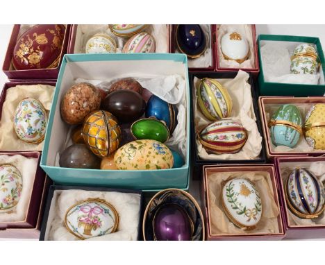 Collection of egg-form trinket boxes, mostly Limoges and retailed by Asprey and in original boxes, porcelain and enamel, vari