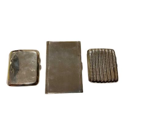 Early 20th century silver cigarette case of rectangular form, with engine turned decoration and two other cigarette cases (va